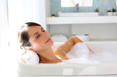 Beautiful woman relaxing in bathtub
