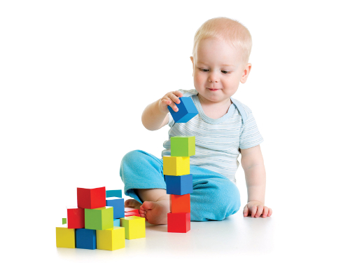 baby toddler playing with building block toys