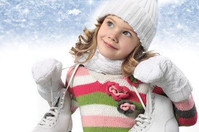 girl in winter clothes with figure skates